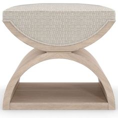 a wooden stool with a white upholstered seat and beige fabric on the top