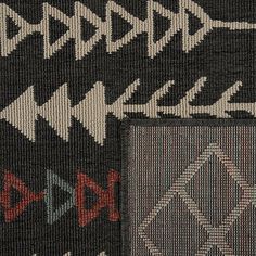 an area rug with different designs on it