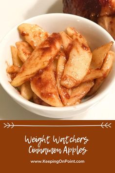 a white bowl filled with cinnamon apples on top of a table