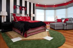 a bedroom decorated in black, white and red