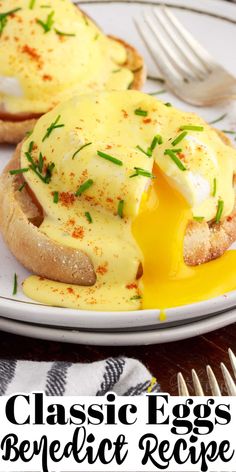 an english muffin with eggs and cheese on it is sitting on a plate next to a fork