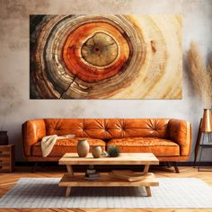 a living room filled with furniture and a large painting on the wall above it's coffee table