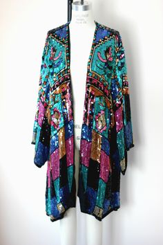 "I absolutely am Over the moon for Sequined long jackets..First, they are rare..second..they are amazing..third...well they are Sequined Dusters!! Vintage amazing hand beaded sequined dusters..and it doesnt get much better than that!! This one is beautiful. It is unmarked, so I do not know the maker. It is a bit of a swing coat. There are hook and eyes on the front but it can easily be worn open. The size is probably great for a M- XXL I do not see any missing sequins. Very good condition This m Dusters, Silk Jacket, Beaded Top, Southwestern Style, Long Jacket, The Maker, Over The Moon, Jacket Vintage, Womens Jackets