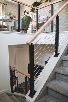 a stair case in a house with white walls