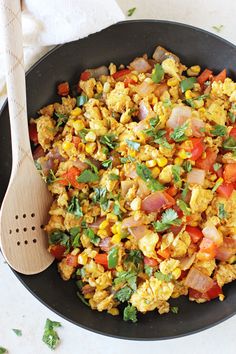 scrambled eggs and vegetables in a skillet