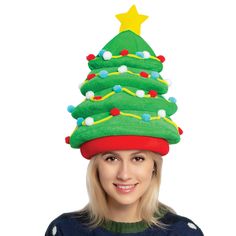 a woman wearing a green christmas tree hat