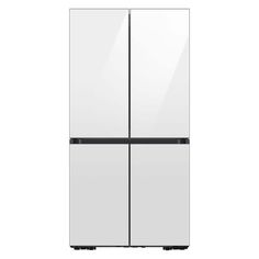 a white refrigerator freezer sitting next to each other