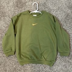 Never Worn! Green With Gold Flecks In The Thread Making It Have A Slight Shimmer Nike Green Crew Neck Sweatshirt, Basic Nike Winter Tops, Nike Basic Long Sleeve Tops, Basic Long Sleeve Nike Tops, Nike Green Long Sleeve Tops, Jordan Green, Gold Nike, Black Quarter Zip, Nike Gold