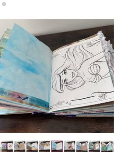 an open book with drawings on it sitting on top of a wooden table next to other books