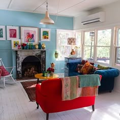 a living room filled with furniture and a fire place