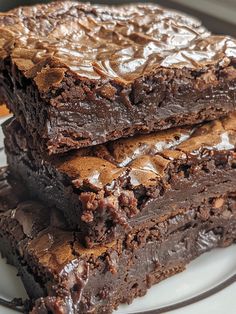 three pieces of chocolate brownie stacked on top of each other