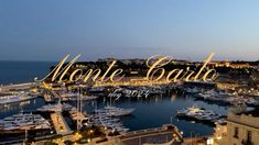 the words monte carlo are lit up in front of boats