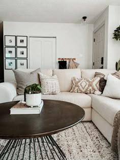 a living room filled with furniture and pillows