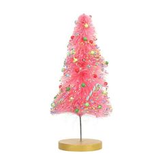 a pink christmas tree with lots of colorful beads on it's top and base