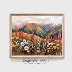 a painting hanging on the wall with flowers and mountains in the background