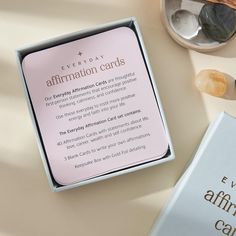 an open box containing information cards for every day affirmation cards and other items