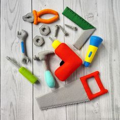 various tools laid out on a white wooden surface