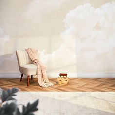 a chair with a blanket on it sitting in front of a wall that has clouds painted on it