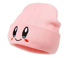 a pink beanie with eyes on it