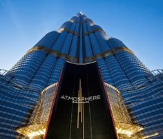 the entrance to an office building with lights on it's sides and a large sign that reads atmohiree