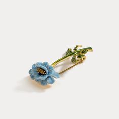 Blue flower Brooch, among our fine jewelry on Selnichast store. It is one of our enamel jewelry that you can give as a birthday gifts for friends or aniversay gift for wife. This is the best enamel jewelry that you cannot miss. This Blue Floral Brooch is a beautiful and timeless accessory for any outfit. Crafted with brass and enamel, this intricate brooch has a classic cottagecore aesthetic that is sure to elevate any look. Perfect for special occasions or everyday wear, this piece is sure to b Yellow Gold Enamel Brooches, Blue Brooch Lapel Pin As Gift, Elegant Blue Enamel Brooches, Elegant Enamel Brooch Pin, Elegant Flower Enamel Pin, Elegant Yellow Gold Enamel Pin Gift, Blue Enamel Brooch For Gift, Blue Enamel Brooch Gift, Blue Enamel Brooches For Gift