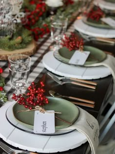 the table is set with plates and place settings