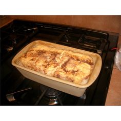 a casserole dish sitting on top of an oven