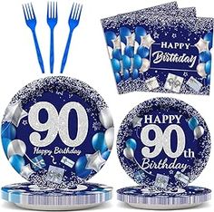 blue and silver birthday party supplies including plates, forks and napkins with the number 90 on it