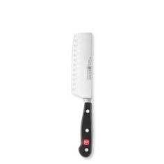 a large knife on a white surface with black handles and red lettering that reads, chef