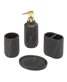 black bathroom accessories set with gold accents