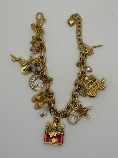 "RARE Signed Vintage Kirks Folly Cinderella  charm bracelet.  Marked Kirks Folly.  Measures 8\" long.  The condition is very good. Castle, glass slippers, stagecoach, etc symbols of the famous story." Jewelry Closet, Glass Slippers, Kirks Folly, Expensive Jewelry Luxury, Chunky Jewelry