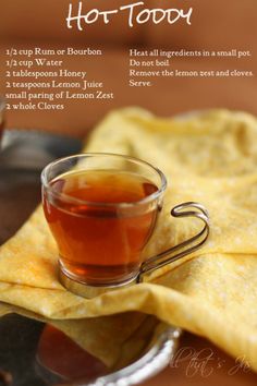 a cup of tea on top of a table next to some tortilla chips