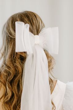 Introducing the Francine Bow hair clip — a hair accessory that adds a new twist to your bridal veil look! Let your hair down and let this bow clip add a playful, fun-filled twist to your bridal wardrobe! I T E M D E T A I L S Large hair barrette Stiff Mesh Bow Pearl details at center of bow Long tails to create veil like look This product is shipped from our offices, therefore: Has a 1-3 business day production time prior to shipping Product is eligible for returns: Contact us within 2 days of d Bridal Hair Bow, Tulle Hair Bows, Bridal Wardrobe, Mesh Bows, Long Hair Wedding Styles, Pearl Details, Bow Hair Clip, Let Your Hair Down, Bow Clip