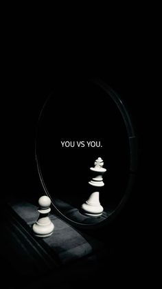 a mirror with chess pieces in it and the words you vs you written on it