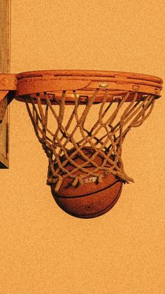 a basketball is in the hoop with no net on it's backboard, as seen from below