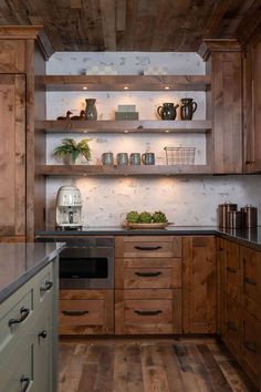 a kitchen with wooden cabinets and shelves filled with pots and pans on top of them