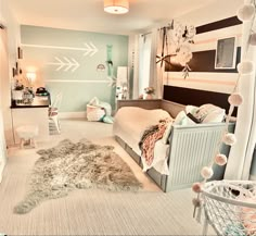 a bedroom decorated in pastel colors and white