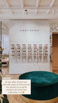 a large green ottoman in front of a wall with glasses on it and the words jimmy parley above it