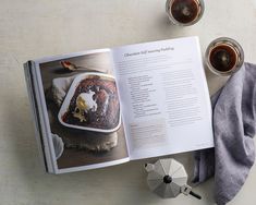 an open cookbook sitting on top of a table