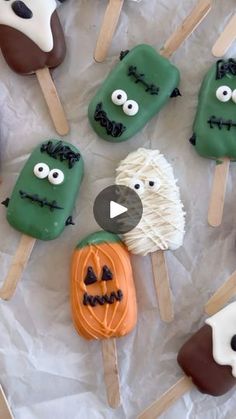 an assortment of halloween treats on sticks