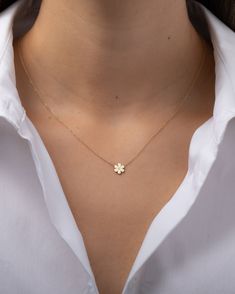 Beautifully handcrafted 14k solid gold dainty flower pendant with a single small diamond, hanging from a dainty cable link chain. A classic and timeless necklace, lays beautifully by itself or layered. Diamond Quality: VS Size: Approx. 7mm Weight: Approx. 1 gram Standard Production: 4-8 business days Rush Order Production: 2-5 business days Shipping: Select shipping method at checkout. Shipped from our L.A. Studio. Single Chain Necklace, Tiny Gold Jewelry, Cute Small Necklaces, Pendant For Girls Gold, Dainty Gold Pendant, Dainty Gold Necklace Pendant, Small Chains Gold With Pendant, Cute Gold Pendants, Gold Necklaces Simple