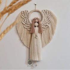 an angel decoration hanging on the wall