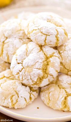 lemon crinkle cookies stacked on top of each other