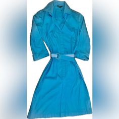 A Modern Shirt Dress In Stretch Material With A Concealed Side Zipper Closure And Belted Waist By Boss Womenswear. The Stock Photos Show How It Looks On, Absolutely Stunning And Sophisticated As Always! There Are 2 Small Buttons At The Front Neck To Wear More Conservatively Or You Can Leave These Undone For A More Relaxed Business Casual Look. Pair With Your Favorite Blazer Jacket And Heels! There Materials Boss Uses Are Always At Least 60% More Sustainable Raw Materials. This Product Is Made Wi Blue A-line Shirt Dress For Daywear, Chic Blue A-line Shirt Dress, Light Blue Cotton Shirt Dress For Work, Elegant Blue A-line Shirt Dress, Light Blue Collared Cotton Dress, Blue Cotton Shirt Dress For Work, Blue Cotton Office Dress, Collared Blue Shirt Dress For Office, Light Blue Collared Daywear Dress