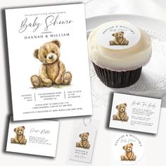 a cupcake with a teddy bear on it next to some baby shower cards and tags