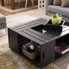 a living room with a couch, coffee table and rugs on the floor in front of it