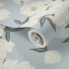 a blue and white wallpaper with flowers on it