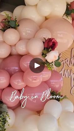 baby in bloom balloons with roses and greenery