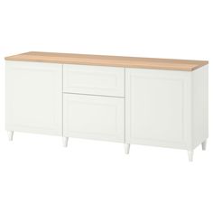 a white cabinet with two doors and drawers on one side, an unfinished wood top