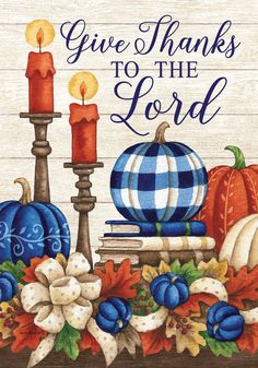 a sign that says give thanks to the lord with pumpkins and other fall decorations